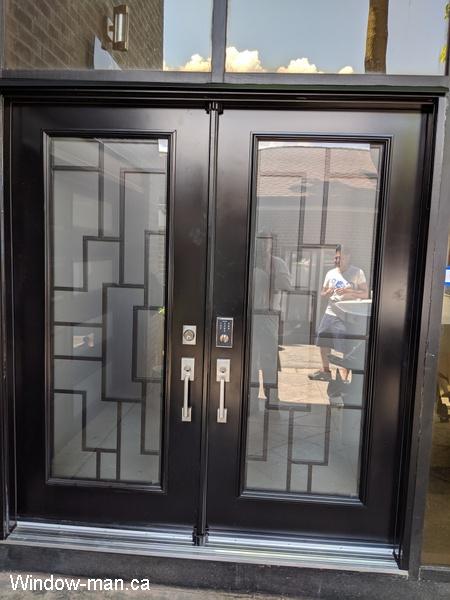 Modern front door design. Entry insulated steel exterior. Black. Present Malibu iron glass inserts